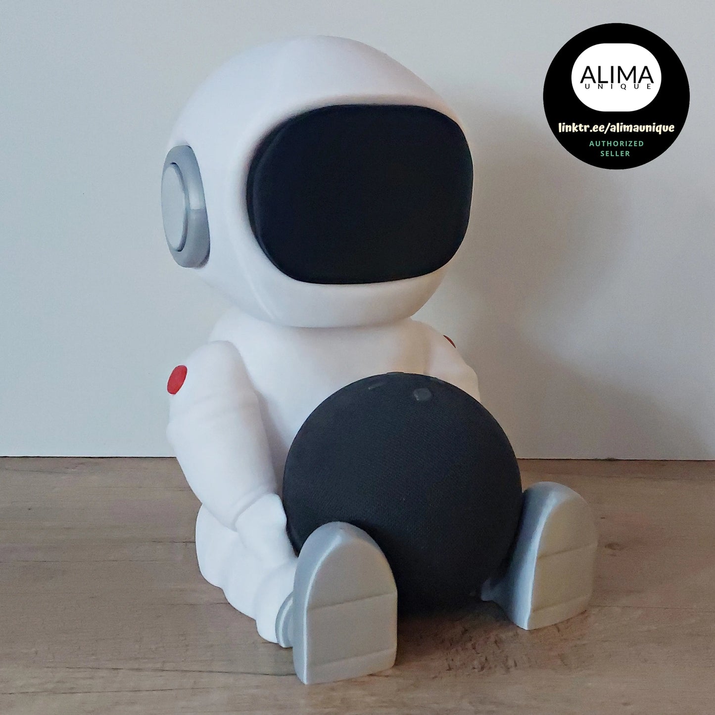 3D printed white robot figure holding a black sphere on wood floor, megahobby 3D creation