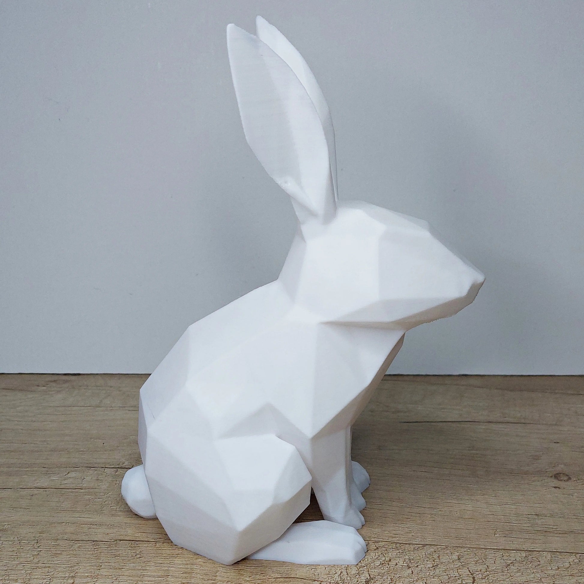 White geometric 3D printed rabbit figurine on wooden surface, megahobby3dcreations decor